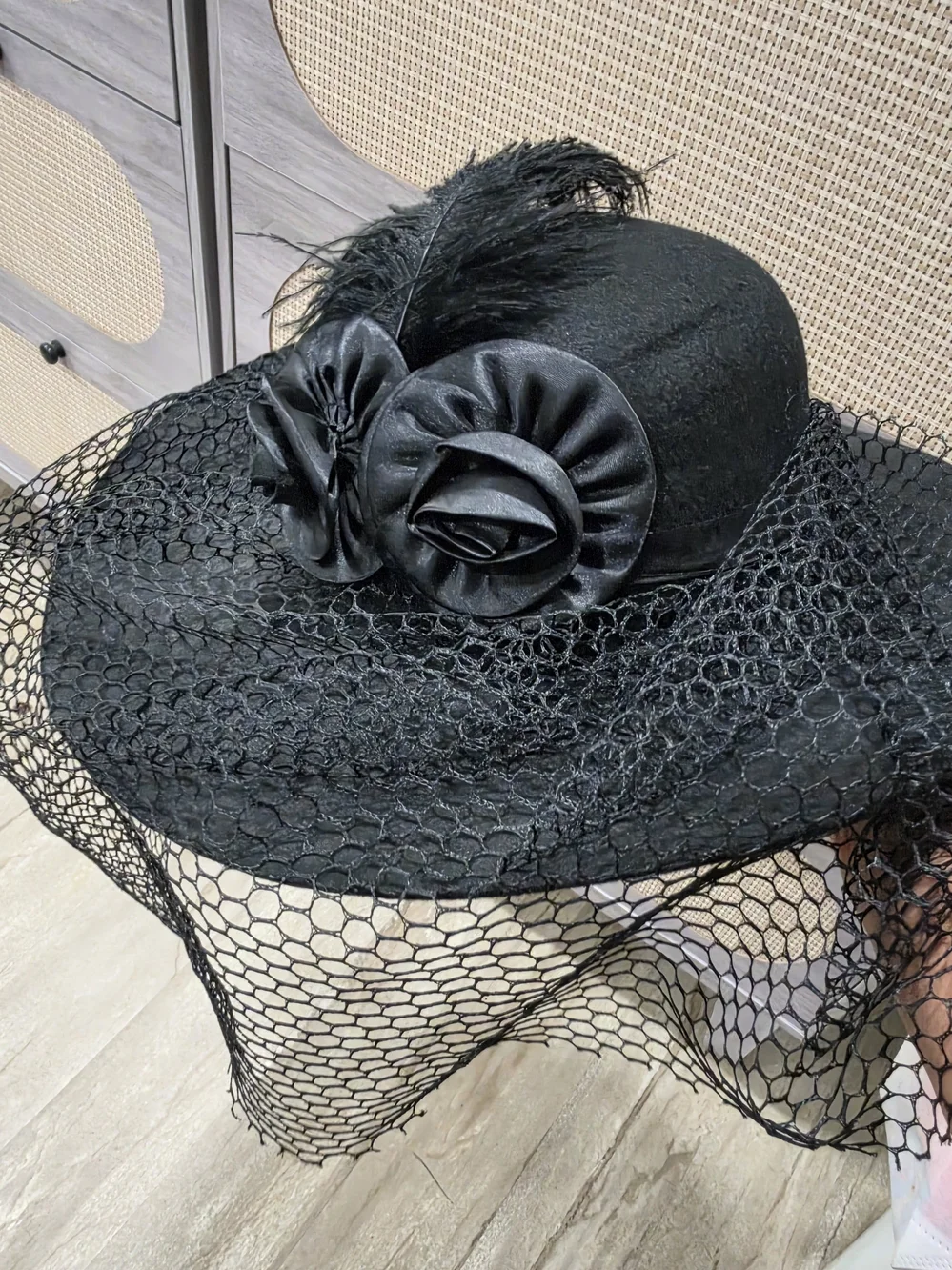 Elegant Black Veiled Hat with Rosette Accents